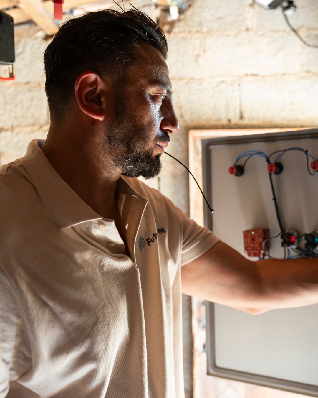 Technician working on plantation irrigation controls